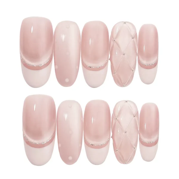 Soft pink cat eye press-on nails with quilted and polka dot accents – long oval fake nails