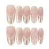 Rose gold-pink cat eye press-on nails with gold French tips, quilted and polka dot accents – long oval fake nails