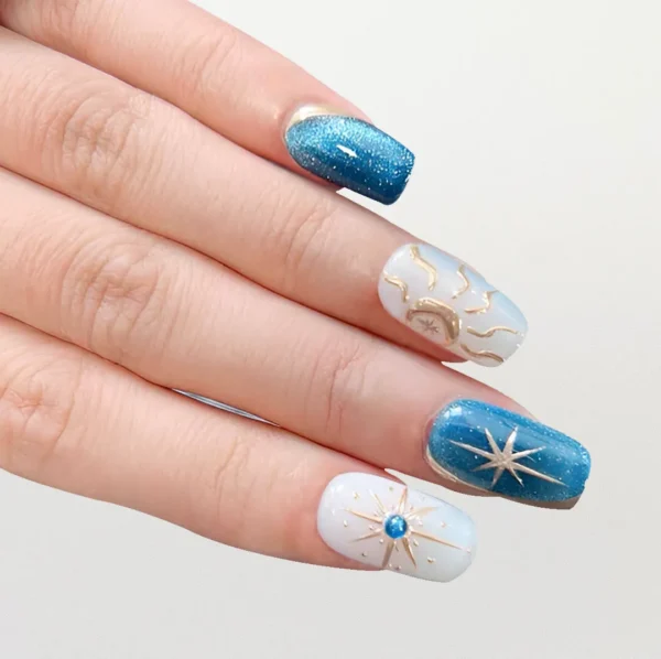 Blue celestial cat eye press-on nails on finger